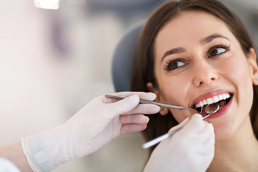a woman getting a dental exam