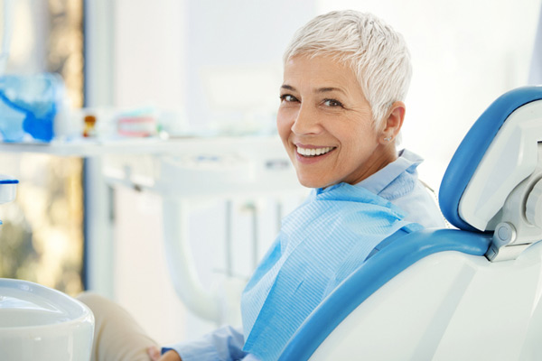 A woman smiling in dental chair at Mountain State Oral and Facial Surgery in Charleston, WV